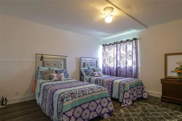 a bedroom with double bed and a window