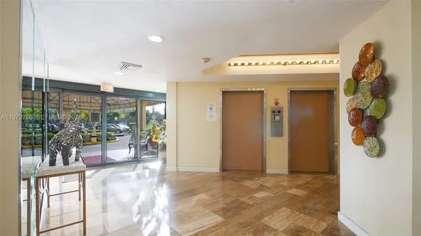 a view of a hallway with furniture and garden view