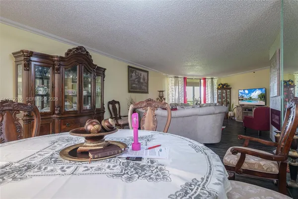 a room with furniture a air conditioner and a large window