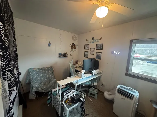 a workspace with furniture and window