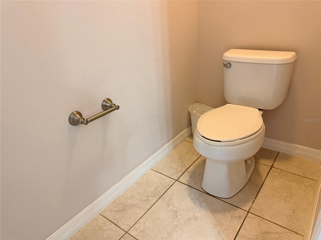 2084 Water Tupelo Way Ocoee, FL 34761 - Photo 17 of 34 a bathroom with a toilet and a shower