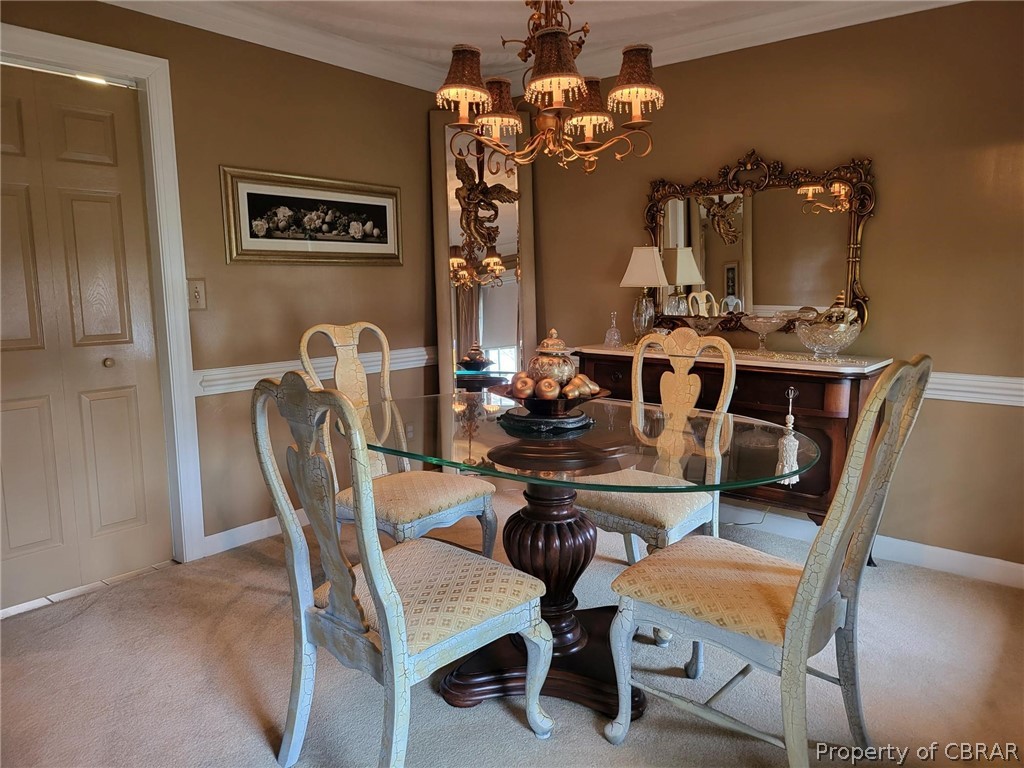 2449 Everglades Road Norfolk, VA 23518 - Photo 11 of 31 a view of a dining room with furniture and chandelier