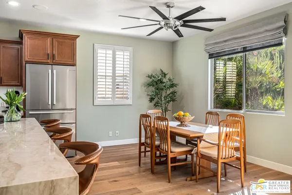 a dining room with furniture and window