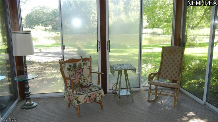 8213 Springview Road Northfield, OH 44067 - Photo 11 of 14 Enjoy the change of the seasons and mother nature from this enclosed patio!