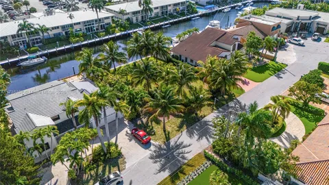 an aerial view of a house with a garden and plants