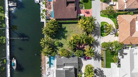 an aerial view of residential house with outdoor space and swimming pool