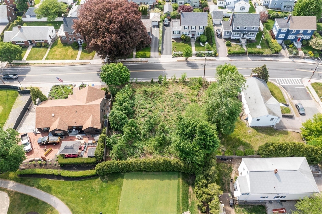 301 Common Street Watertown, MA 02472 - Photo 5 of 6 an aerial view of residential houses with yard and swimming pool