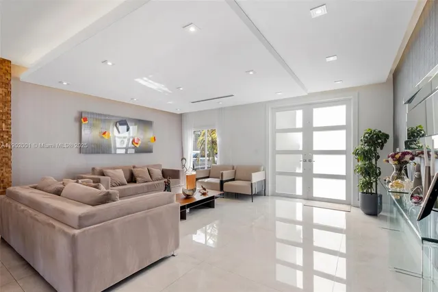 a view of a dining room with furniture and a large window