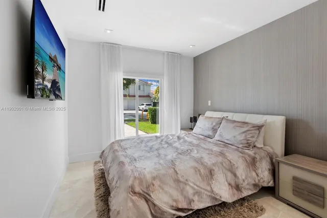 a bedroom with a bed and a couch