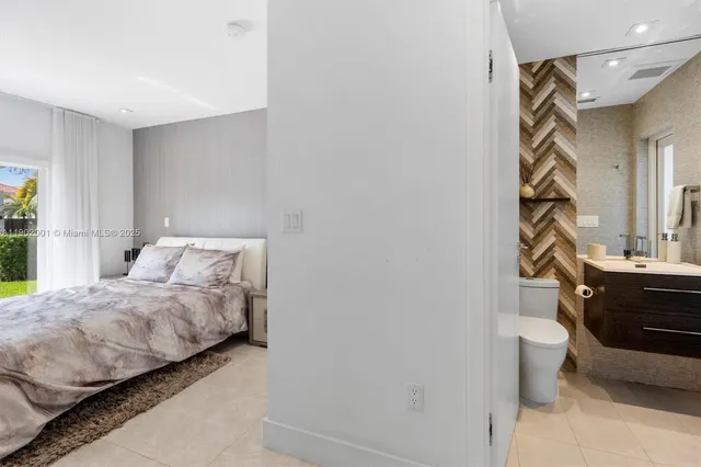 a bathroom with a sink a toilet and a window