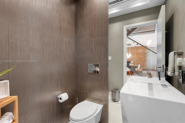 a bedroom with a bed and a mirror