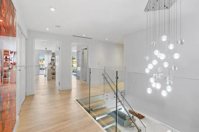 a view of a house with swimming pool and sitting area