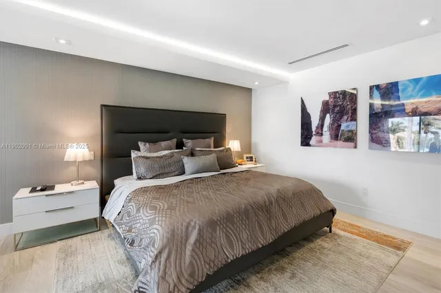 a open kitchen with stainless steel appliances granite countertop a stove a chimney and a potted plant