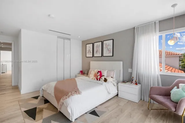 an outdoor space with furniture and garden