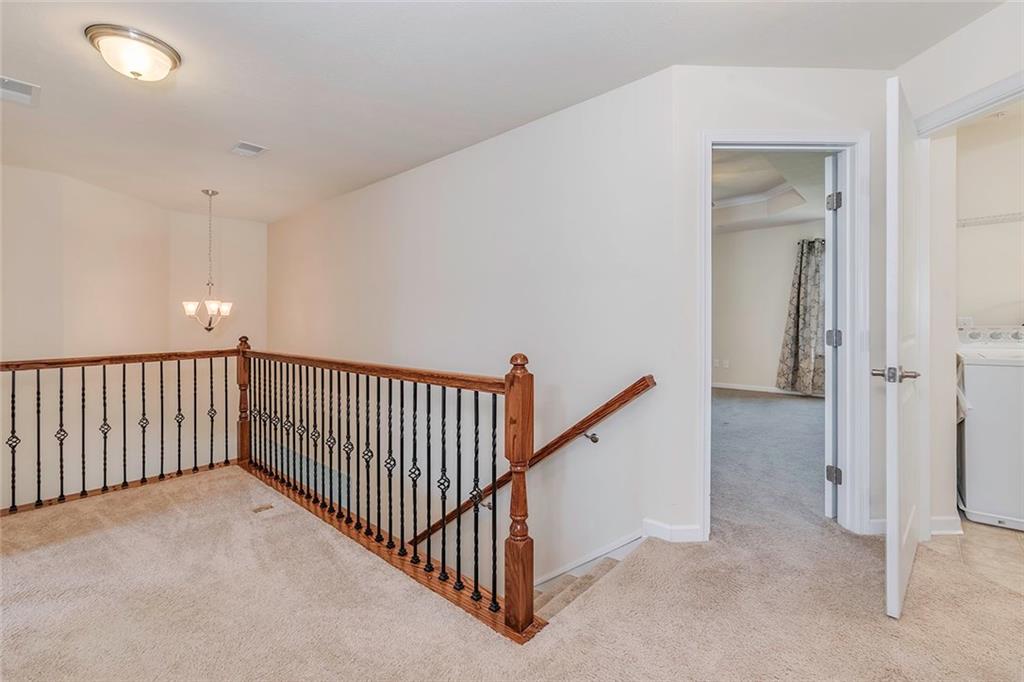 614 Rosecliff Road Wexford, PA 15090 - Photo 11 of 23 This is the loft at the top of the steps, great for a cozy reading area. It also shows the entry to the master bedroom and the laundry conveniently located on the second floor. Both the washer and dryer are included in the sale of the home.