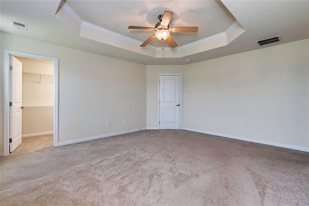 614 Rosecliff Road Wexford, PA 15090 - Photo 13 of 23 This shows the large master bedroom with the second walk-in and the tray ceiling and ceiling fan as well.