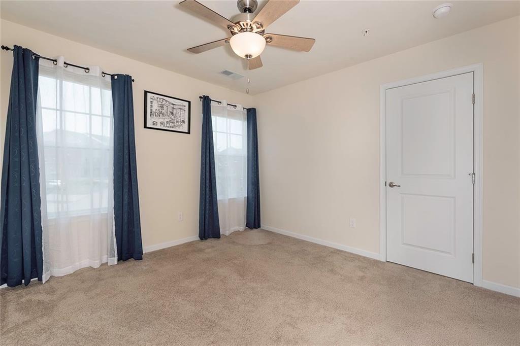 614 Rosecliff Road Wexford, PA 15090 - Photo 17 of 23 This is the bright and comfortable third bedroom showing the ceiling fan with the door to the closet. THE DRAPES AND PICTURE ARE NOT INCLUDED IN THE SALE but the custom blinds are included in the sale of the home.