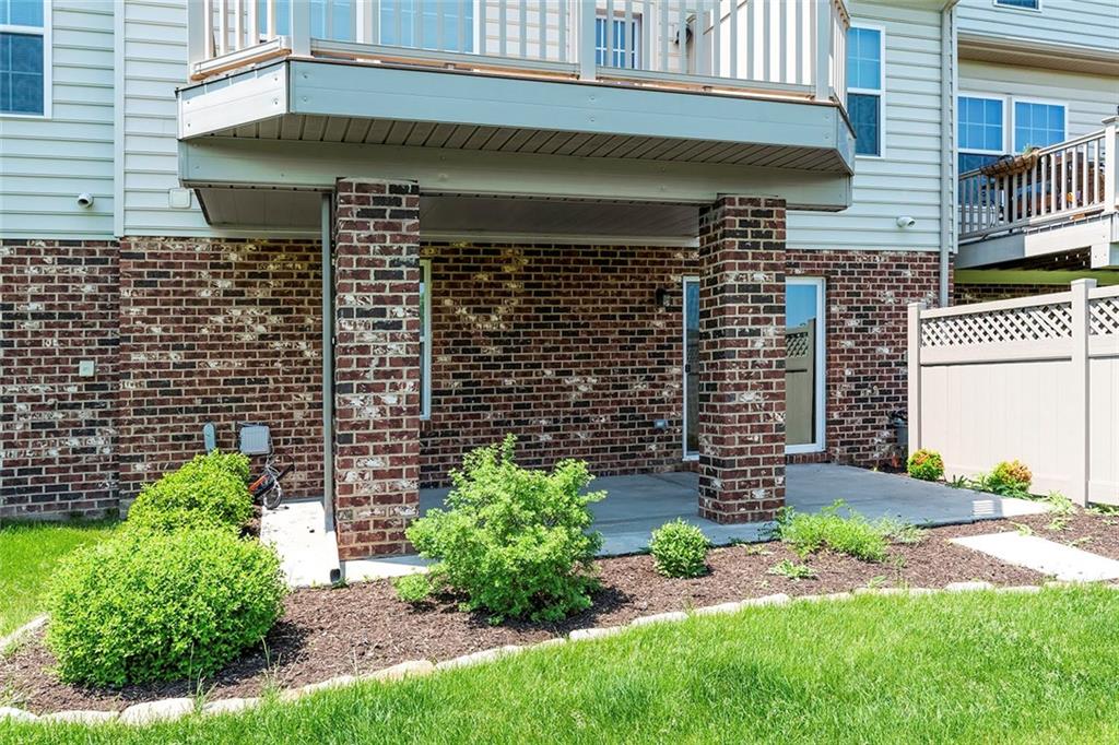 614 Rosecliff Road Wexford, PA 15090 - Photo 22 of 23 This shows the covered patio with the Trex deck above (underdecking keeps it dry). It is a walk-out from the lower level. The garden, lawn and privacy fence is shown as well.