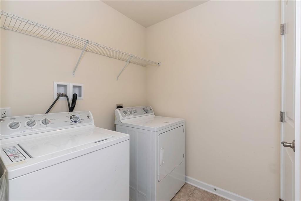 614 Rosecliff Road Wexford, PA 15090 - Photo 23 of 23 The upper level laundry room offers a washer, dryer shelf for laundry supplies and a large linen closet.
