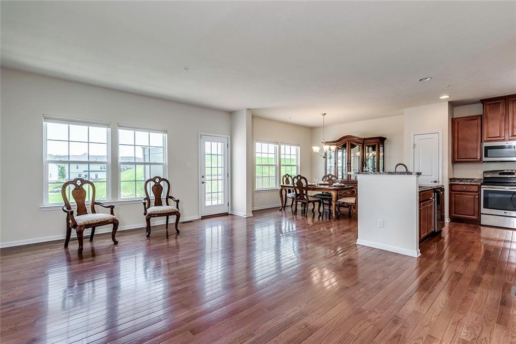 614 Rosecliff Road Wexford, PA 15090 - Photo 5 of 23 Living room, dining room and part of the kitchen. Notice the beautiful hard wood flooring, the brightness and the great openness of the floorplan.