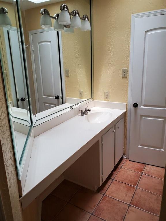 2882 Mackey Lane Shreveport, LA 71118 - Photo 9 of 13 a bathroom with a sink and a mirror