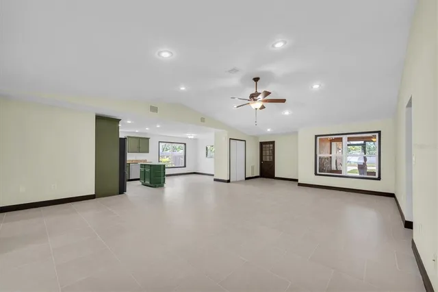 a view of a livingroom with furniture chandelier and fireplace