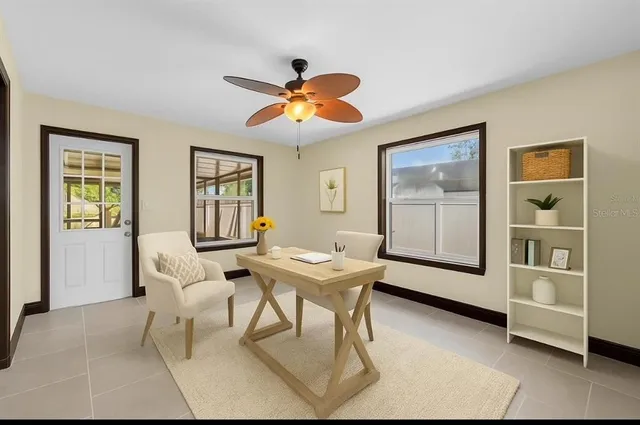 a dining room with furniture and window