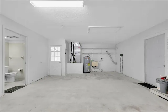 a view of a livingroom with white walls and white walls