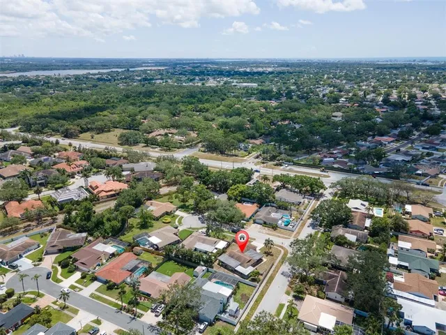 an aerial view of a houses with a lake view