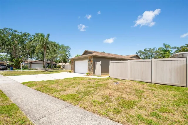 a view of a house with a backyard
