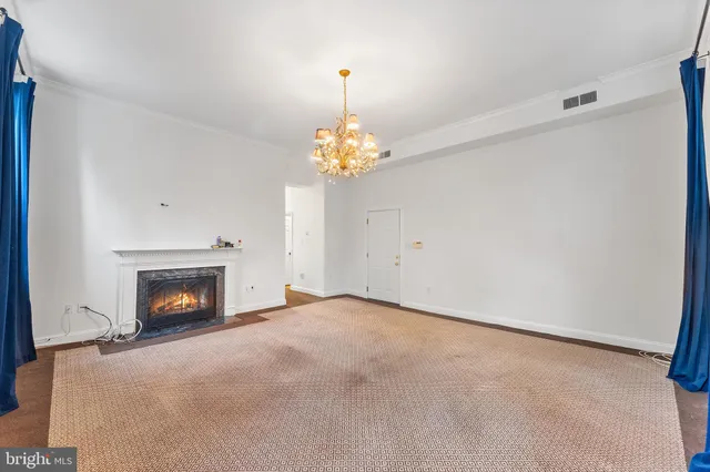 a view of a fireplace in an empty room