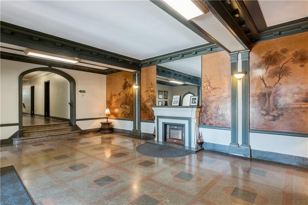 601 79th Street, Unit E10 Brooklyn, NY 11209 - Photo 11 of 14 a view of livingroom with fireplace
