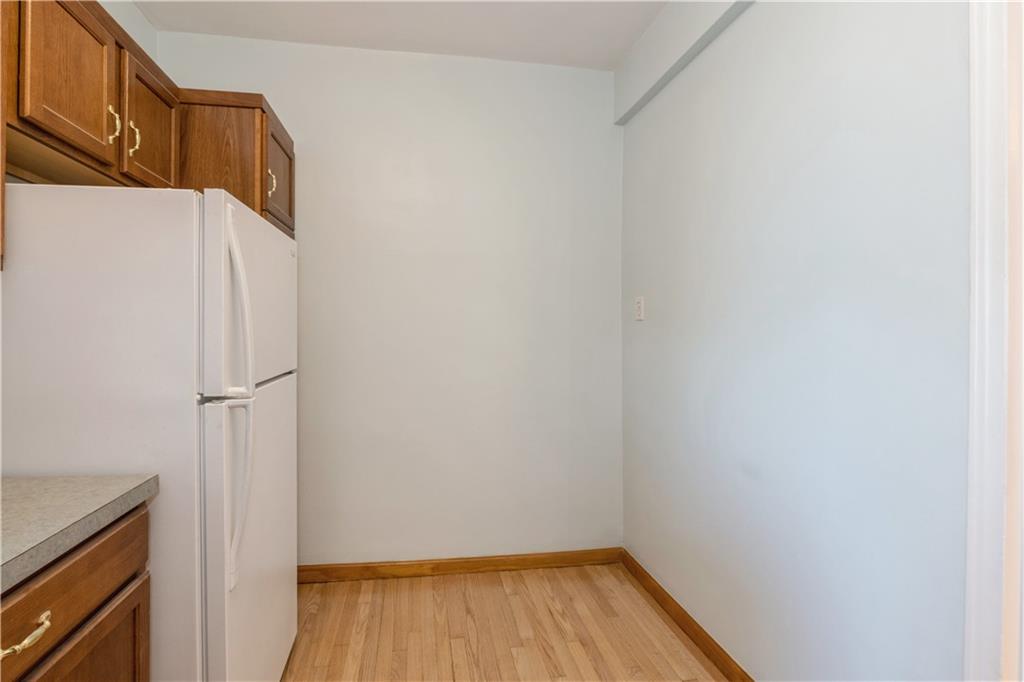 601 79th Street, Unit E10 Brooklyn, NY 11209 - Photo 6 of 14 a view of walk in closet with wooden floor