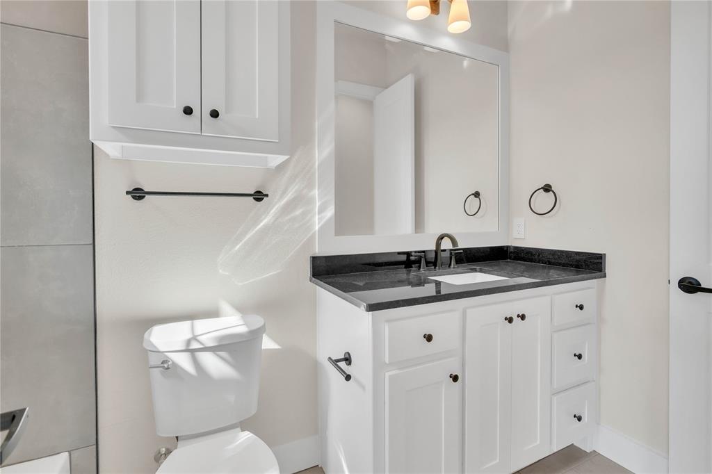 1028 Henry Way Springtown, TX 76082 - Photo 29 of 40 a bathroom with a sink and a toilet