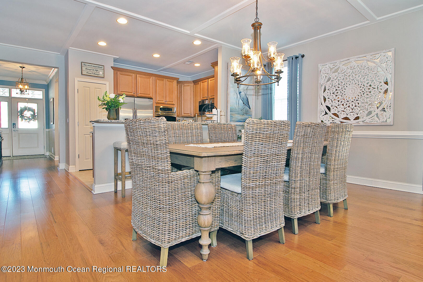 39 Bayville Way Waretown, NJ 08758 - Photo 19 of 55 a dining room with furniture wooden floor a rug and a chandelier