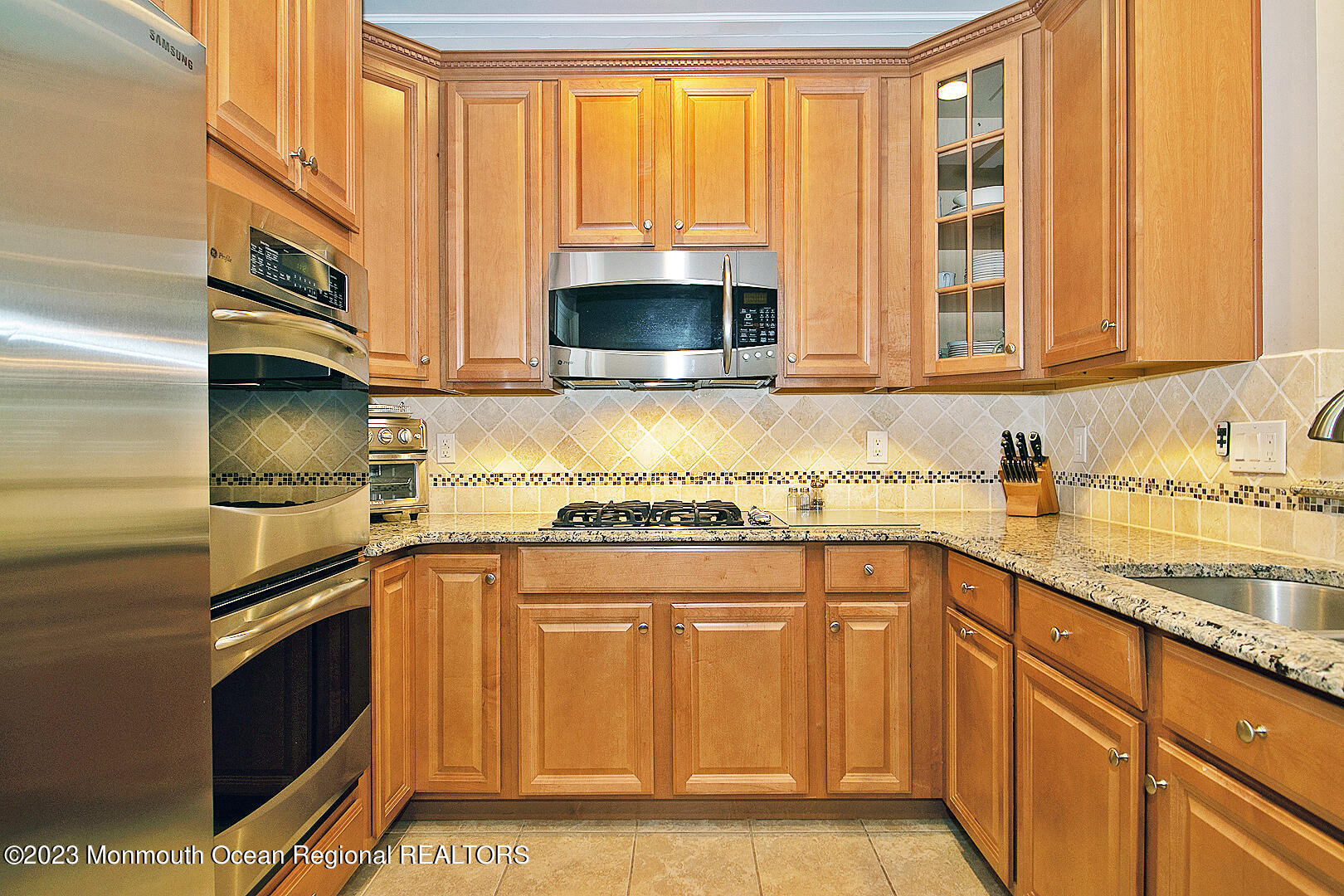 39 Bayville Way Waretown, NJ 08758 - Photo 26 of 55 a kitchen with stainless steel appliances granite countertop a sink and a stove