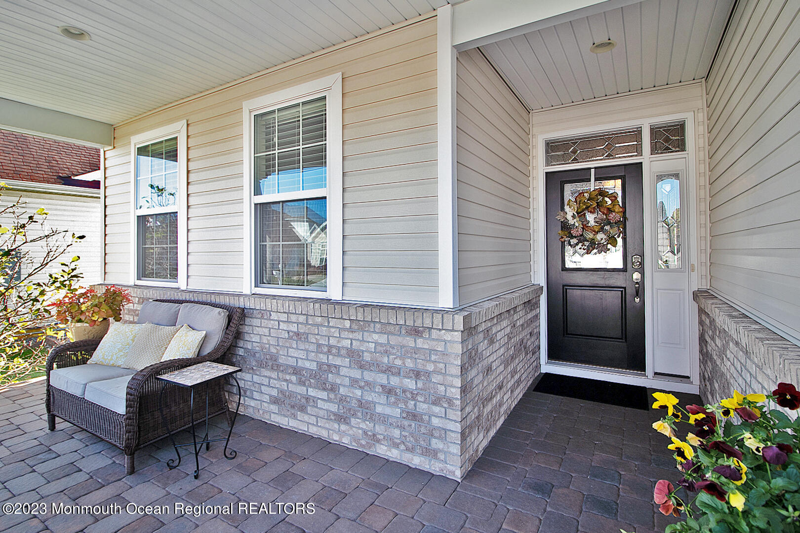 39 Bayville Way Waretown, NJ 08758 - Photo 8 of 55 a brick house with couches in front of it