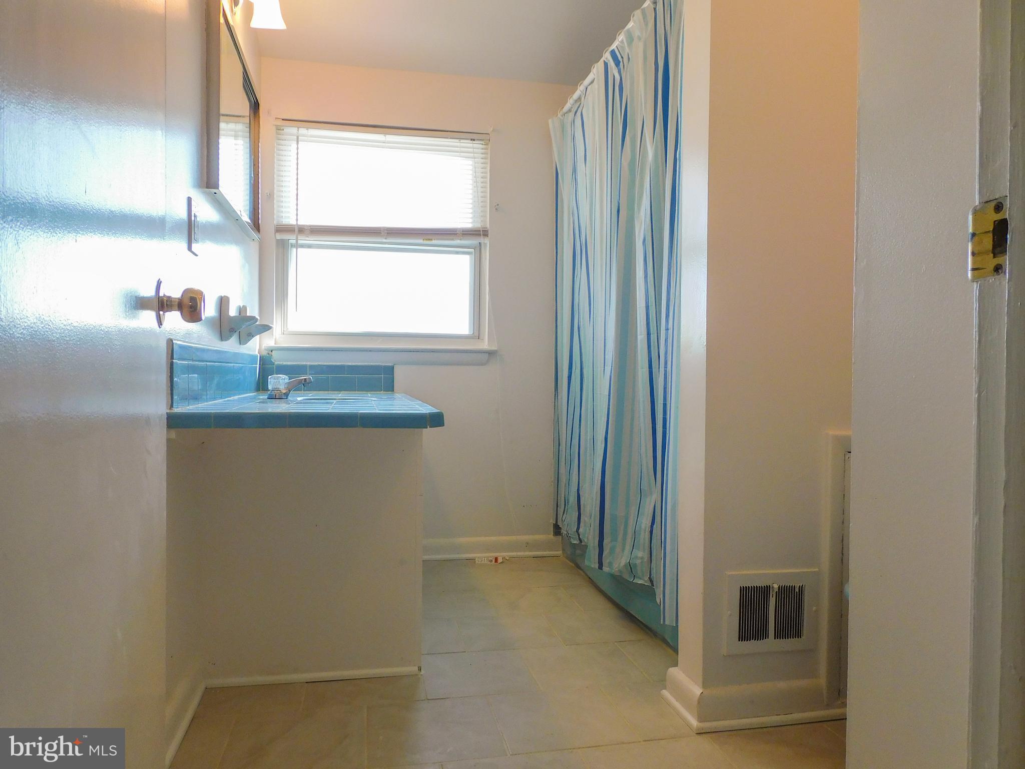 616 Queensgate Road Baltimore, MD 21229 - Photo 20 of 31 Bathroom with updated tile floor