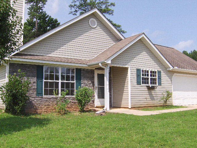 340 Autumn Ridge Trail Gray, GA 31032 - Photo 1 of 1 a front view of a house with a yard and garage