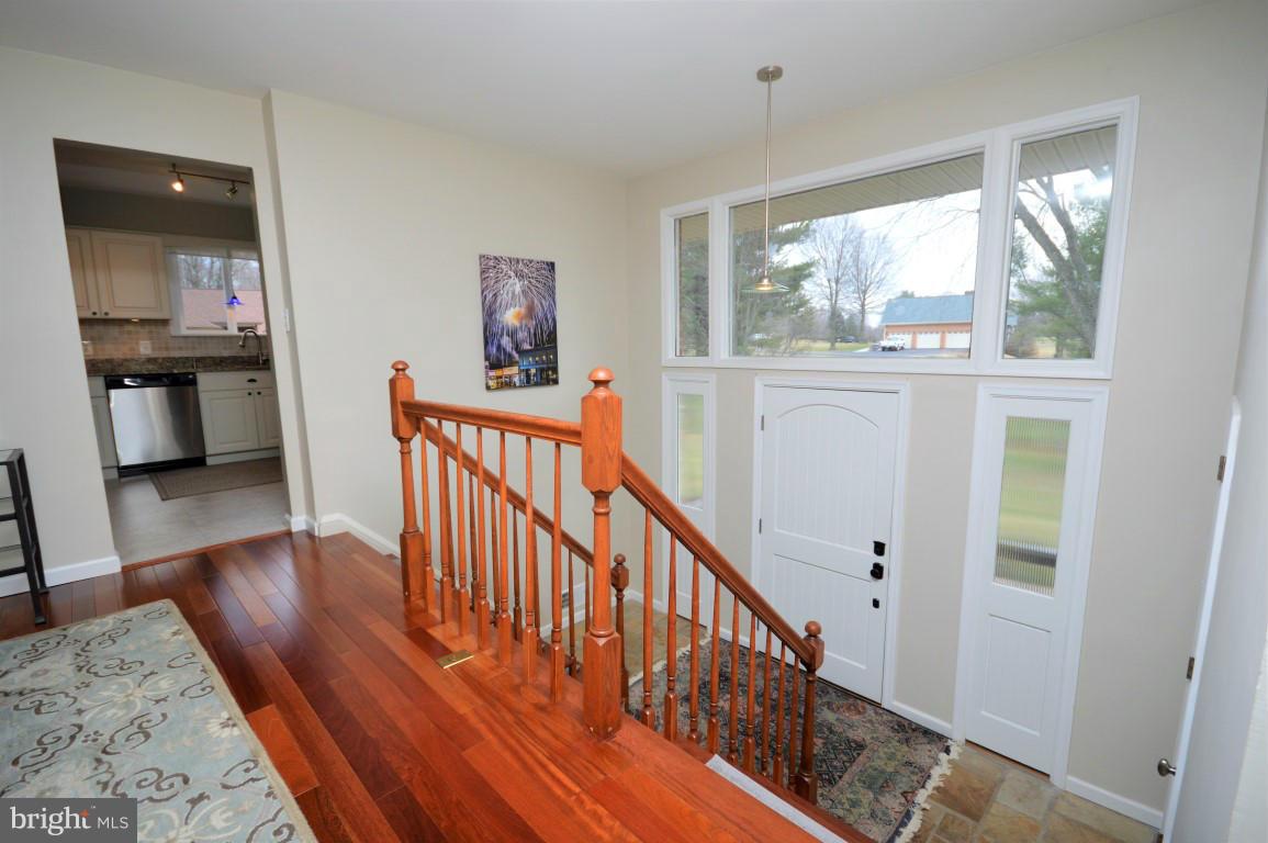 Foyer with Dual Hardwood Staircase