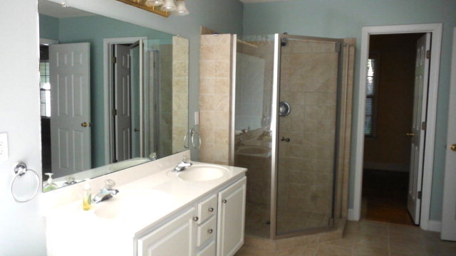 640 Lokchapee Ridge Macon, GA 31210 - Photo 11 of 22 a bathroom with a double vanity sink and a mirror