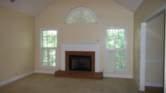 640 Lokchapee Ridge Macon, GA 31210 - Photo 3 of 22 a view of an empty room with a fireplace and a window