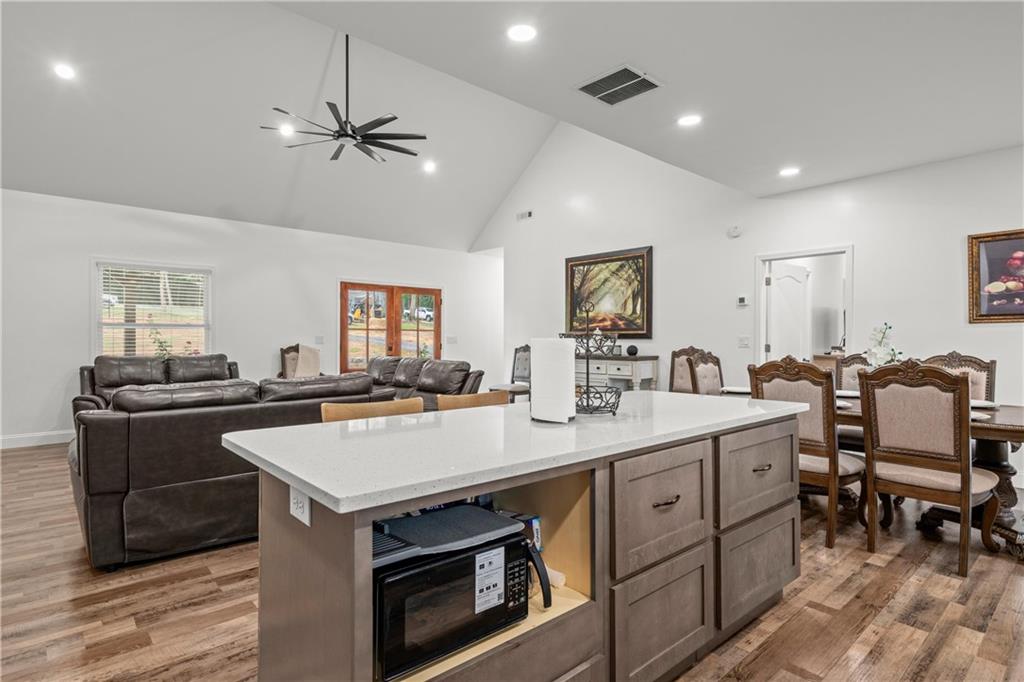 1175 Burwell Mt Zion Road Carrollton, GA 30117 - Photo 12 of 29 a kitchen with a stove a sink and a refrigerator