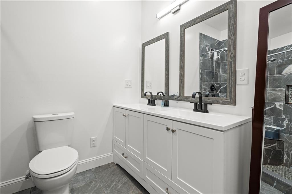 1175 Burwell Mt Zion Road Carrollton, GA 30117 - Photo 15 of 29 a bathroom with a toilet sink and mirror