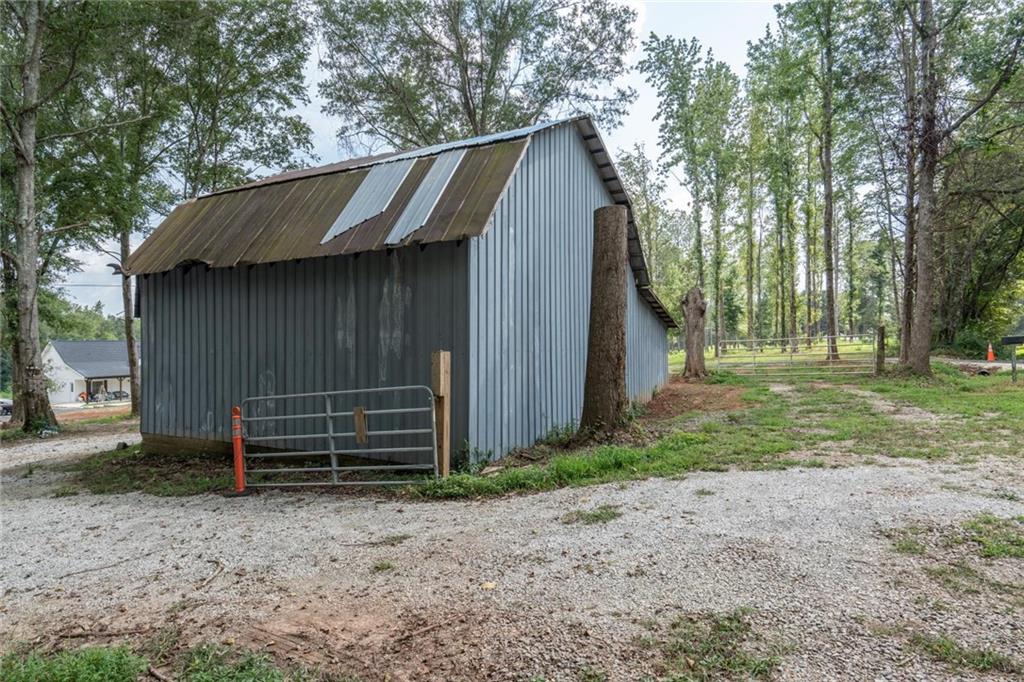 1175 Burwell Mt Zion Road Carrollton, GA 30117 - Photo 24 of 29 a backyard of a house with barbeque oven