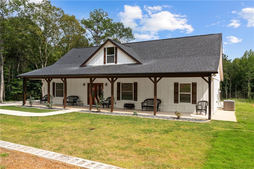 1175 Burwell Mt Zion Road Carrollton, GA 30117 - Photo 3 of 29 a front view of house with outdoor seating and yard