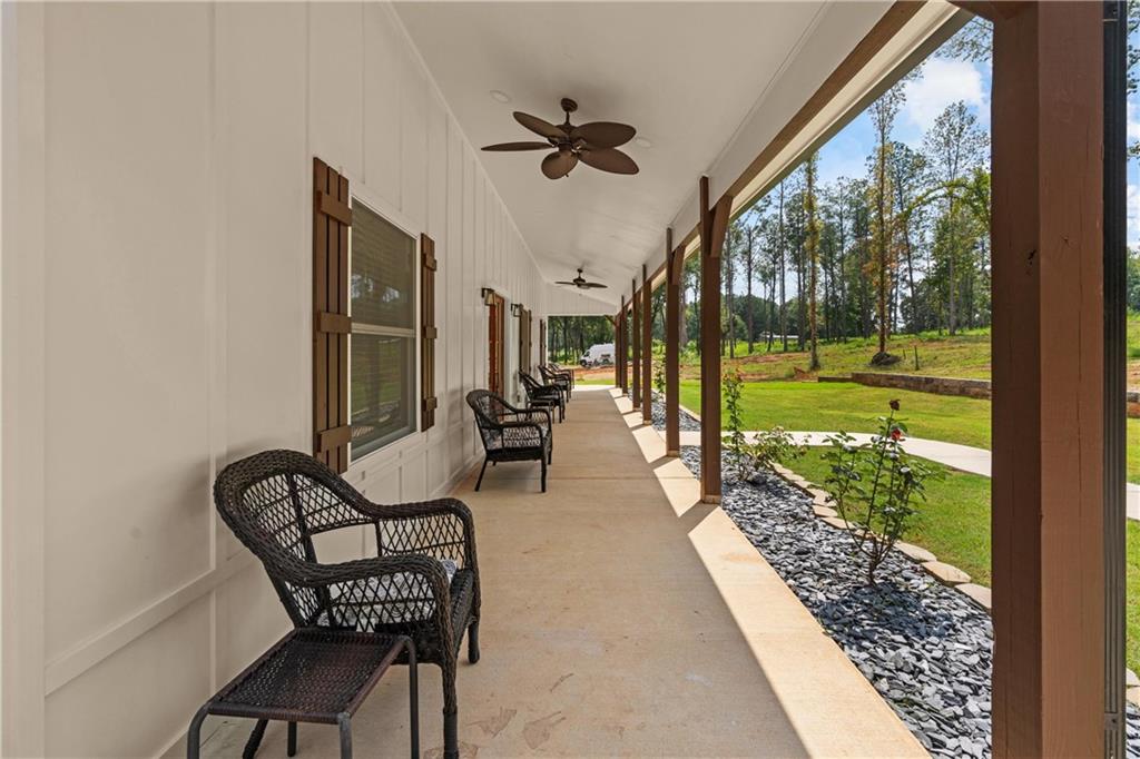 1175 Burwell Mt Zion Road Carrollton, GA 30117 - Photo 6 of 29 a view of a porch with furniture and backyard