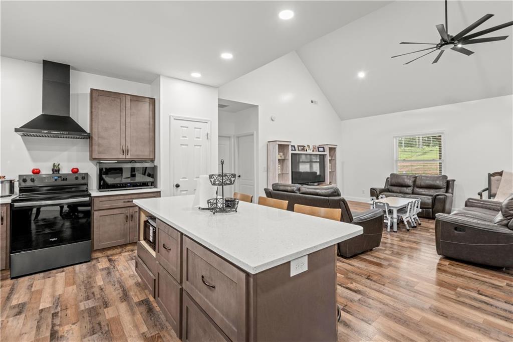 1175 Burwell Mt Zion Road Carrollton, GA 30117 - Photo 10 of 29 a kitchen with sink cabinets and stove top oven