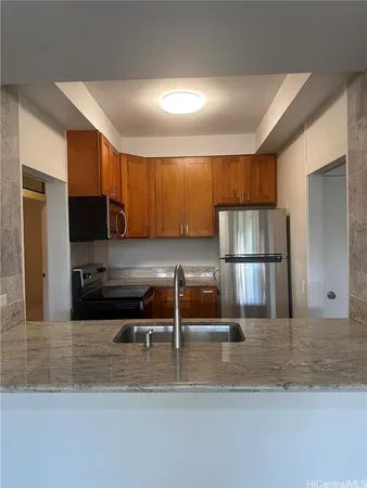 a stove top oven sitting inside of a kitchen