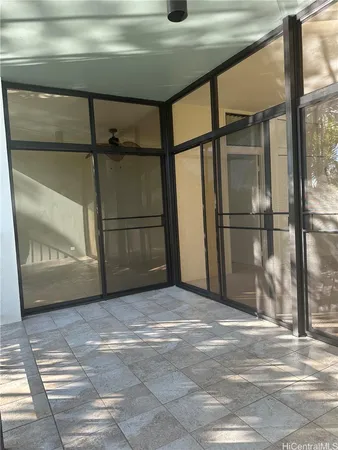 a view of an empty room with a balcony